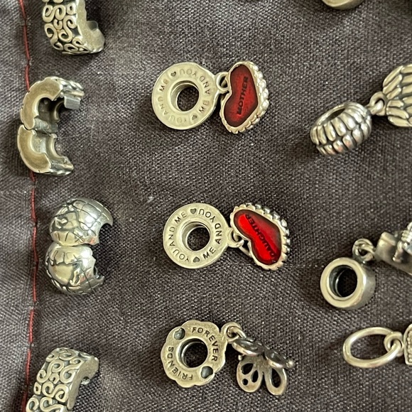 Lot of 26 Authentic Pandora charms.